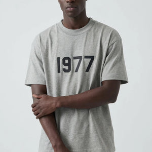 Fear of God Essentials 1977 Donkere Havermout Zomerset