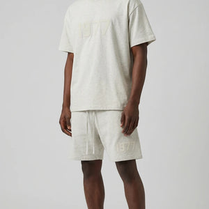 Fear of God Essentials 1977 Lichte havermout zomerset