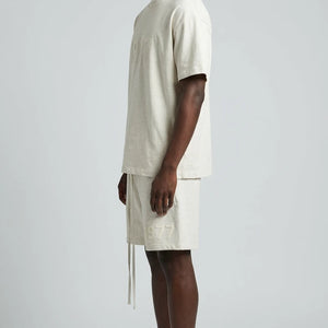 Fear of God Essentials 1977 Lichte havermout zomerset